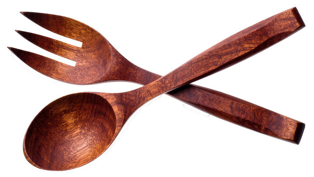 Isolated natural brown wooden serving spoon and fork for healthy food preparation
