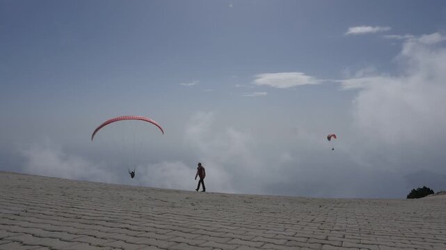 para gliders on a hill getting ready and fly babadag fethiye turkey