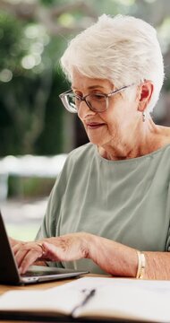 Typing, laptop and senior woman in home, pension payout application and elderly grant registration. Reading, computer and old person with online bank clearance for subsidy, smile and retirement funds