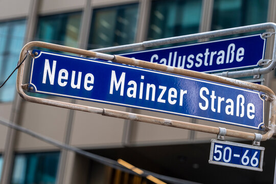 Blue typography streetsign for Neue Mainzer Stra&szlig;e shows street transport and urban finance city in Frankfurt Germany downtown district