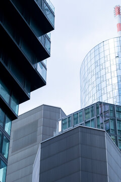 Clean urban office buildings and tower with modern architecture facade under bright sky in Frankfurt Germany business district exterior