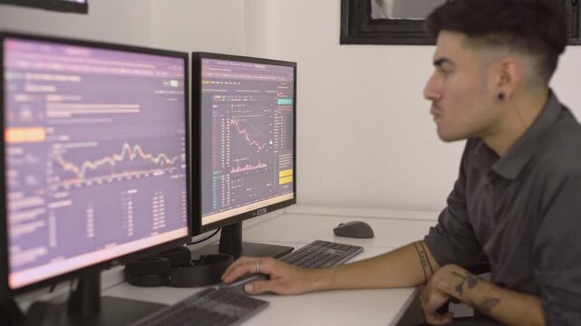 Stock market volatility creating intense tension for professional trader analyzing crashing financial data on multiple computer screens