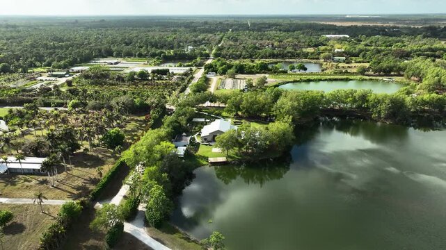 An elevated aerial view captures the warm countryside and pristinely maintained rose gardens that define the White Trail Club flower farm.
