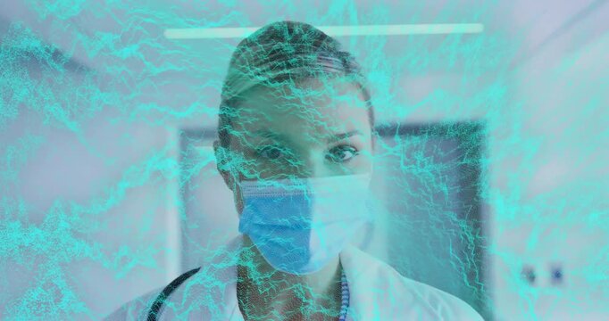 Doctor reacting to turquoise overlay moving across face, straightening gaze, revealing eyes, mask