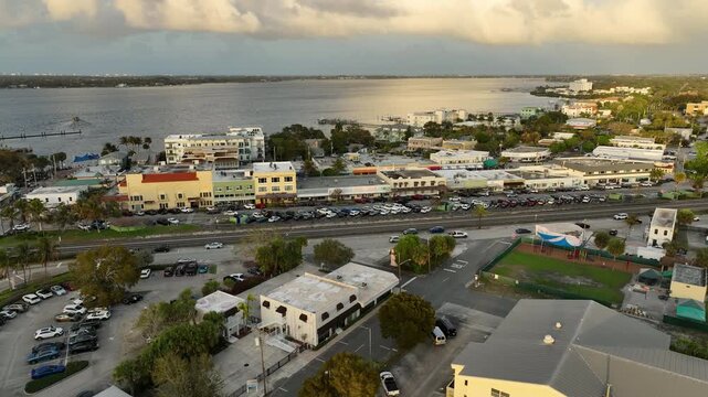 A sweeping aerial shot reveals the charming streets of downtown Stuart framed by palm trees and waterfront views along Florida&rsquo;s Treasure Coast.