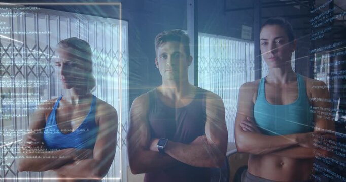 Fitness group posing arms crossed in gym, facing forward, showing sportswear, tracker and overlays