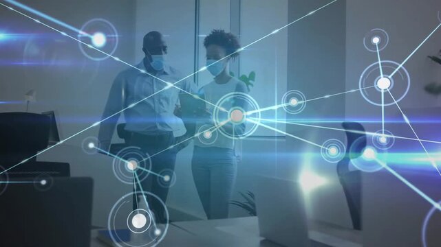 Team walking in office, woman tapping tablet sparking growing data network overlay reviewing data