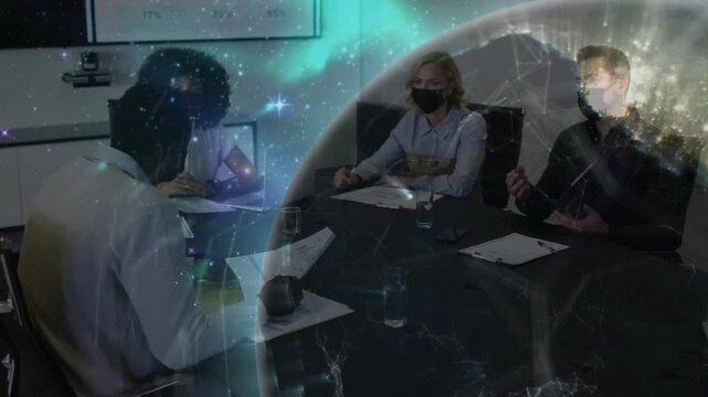 Business panel reviewing documents after candidate presenting, globe rotating and obscuring papers