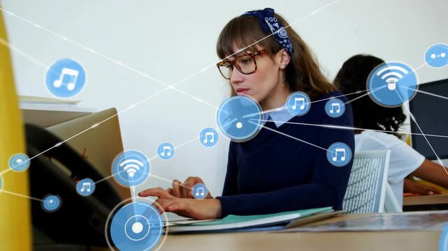 Mid-adult woman typing on laptop blue icons appearing and linking desks showing growing net flow
