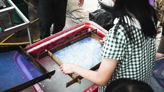 Children learning traditional handmade sa paper craft making process