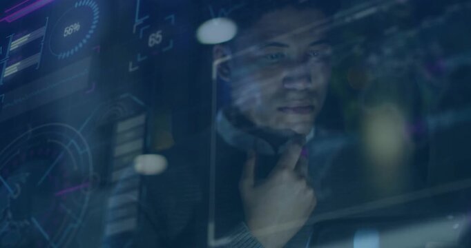 Man standing behind glass display, overlay appearing causing him holding chin and analyzing gauges