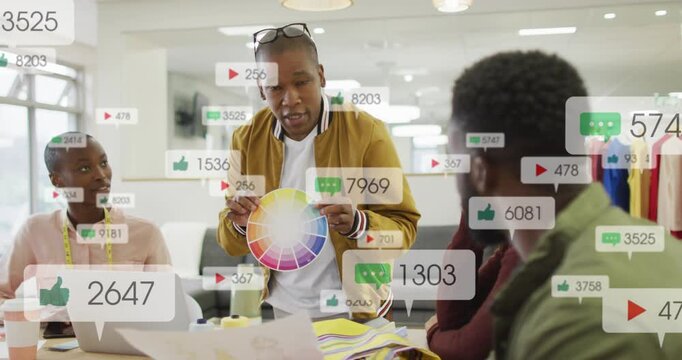 Lead raising color wheel, leading design review, team checking fabrics, icons floating across frame