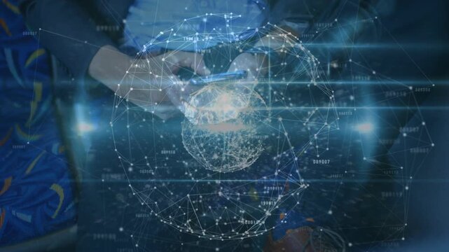 Man tapping smartphone in dim cabin, thumbs swiping and growing holo tech globe visualizing data