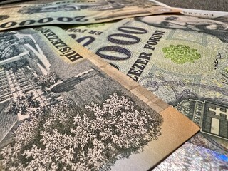 Naklejka premium Hungarian forint banknotes representing economy, travel, and finance
