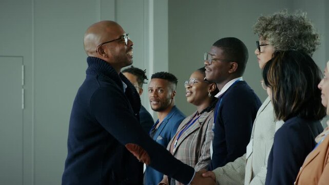 Connecting diverse professionals with warm handshakes at a corporate event