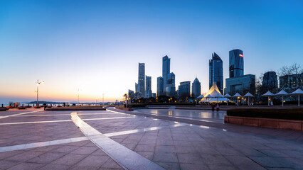 Seaside Cityscape at Dusk with Modern Skyscrapers