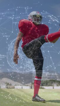 Player lowering ball then punting, sports AR overlay appearing around and showing punt mechanics