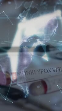 Vertical video: Tech raising palm as hologram forming over monkeypox tubes, tracking global spread
