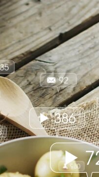 Vertical video: Play badge showing causing frame panning spoon sliding bowl entering counts rising