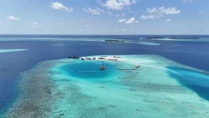 Aerial drone view of Maldives tropical island sandbank and turquoise lagoon reef © FunViralContent