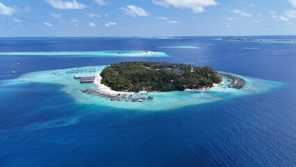 Aerial drone view of Maldives tropical island sandbank and turquoise lagoon reef © FunViralContent