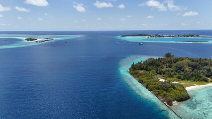Aerial drone view of Maldives tropical island sandbank and turquoise lagoon reef © FunViralContent