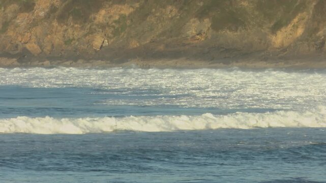 Scenic view of Mundaka on the Cantabrian coast in Bizkaia, famous worldwide for its powerful left-hand surf wave. Coastal town landscape with ocean swell, harbor, and natural surroundings.