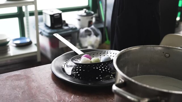 Children learning to make traditional Thai desserts in class