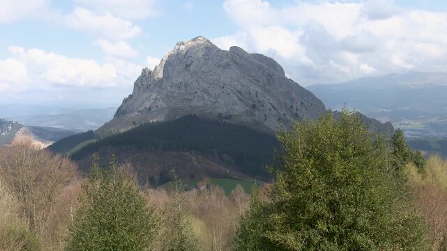 Rocky mountain landscape of Mount Anboto seen from Urkiola Natural Park in the Basque Country. Dramatic cliffs and rugged terrain associated with Basque mythology and natural heritage.