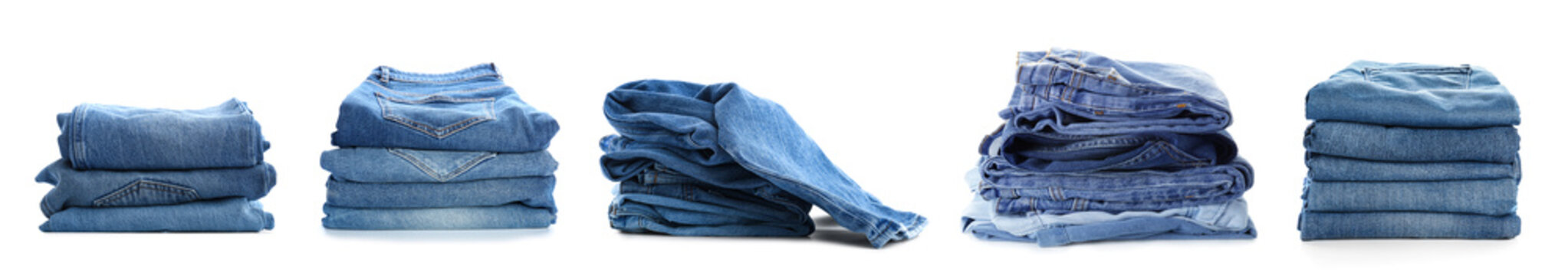 Set of stacked jeans clothes on white background