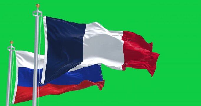 Flags of France and Russia waving together isolated on green background