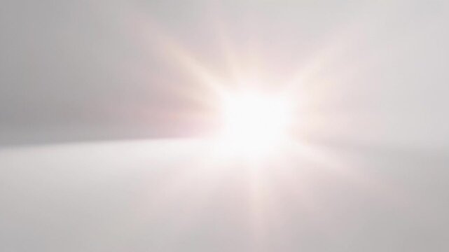 ?Bright light transition with lens flare effect across white background