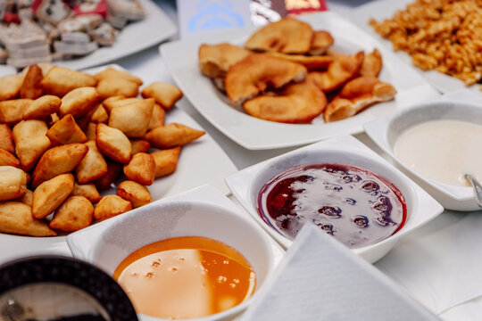 Uzbek flour treats with jam. fried baursaks on the Uzbek holiday Nauryz