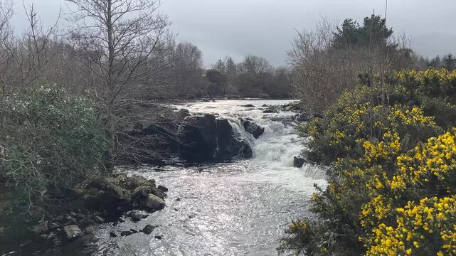 waterfall in the forest, Glenforsa waterfall on the Isle of Mull, Scotland.  Rain and sleet falling in March 2026