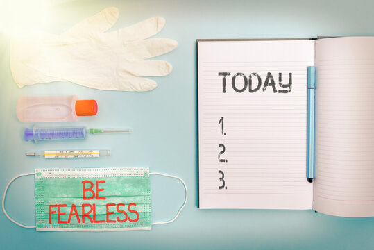 Handwriting text writing Be Fearless. Concept meaning act of striving to lead an extraordinary life and make a difference Set of medical equipment with notepad for health condition assessment.
