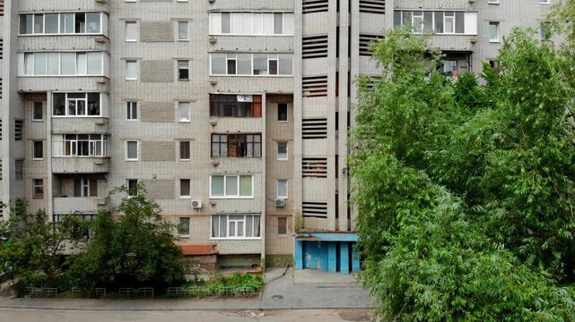 Wide aerial view of a residential district in Sumy, Ukraine with Soviet-era apartment buildings forming a dense urban neighborhood. Typical Eastern European living area and urban planning. 