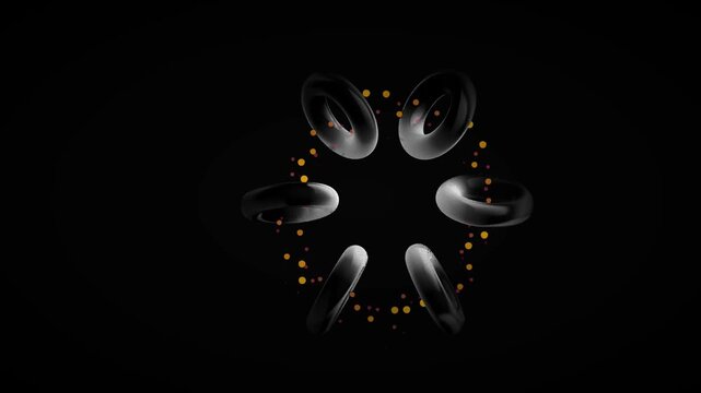 Circular arrangement of black textured toroids with floating orange particles against a dark background for physics and energy concepts