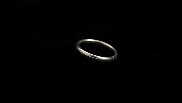 adornment. A pure silver ring displayed on black velvet with soft lighting. lifestyle magazines, social media lookbooks, designed for influencer and brand collaborations.