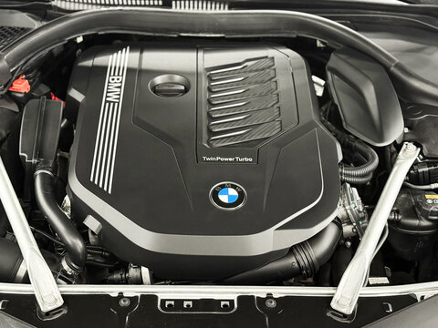 Twin Power Turbo gasoline engine. BMW sport engine or motor under vehicle hood. BMW 8 II (G14, G15, G16) detail of new car engine. Engine motor of BMW car close-up with emblem.