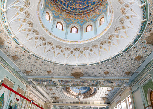 Tashkent (Toshkent), Uzbekistan (O'zbekiston) - May 26, 2025: Architectural interior details of Hazrati Imam Mosque showcasing ornate ceiling patterns, intricate mosaics, and traditional chandeliers