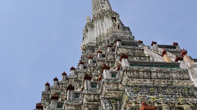 Vertical shot of elaborate temple spire against clear blue daytime sky Wat Arun