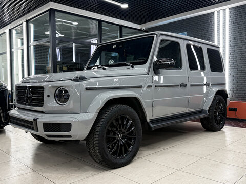 Nardo Grey Mercedes-Benz G-Class AMG II (W465) G 63 4MATIC. Mercedes-Benz G SUV Brabus. Nardo Grey Mercedes G-class AMG G 63 4MATIC in the showroom. Gel&auml;ndewagen. Brabus G 63 Wagon German SUV car.	