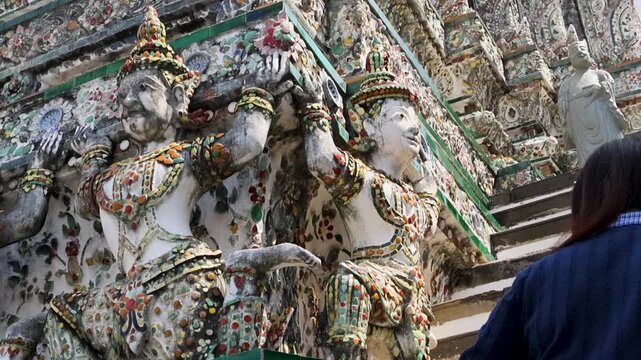 Dramatic perspective showcasing richly decorated ceramic tower Wat Arun