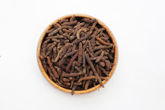 Long pepper (Piper longum), a spice used in traditional medicine and cooking, known for its pungent flavor.