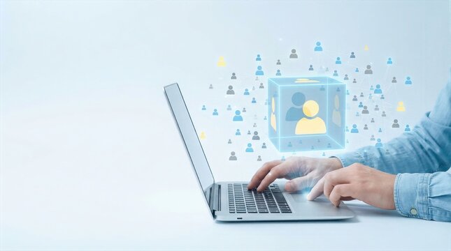 Hands typing on laptop with virtual blue human network cube hovering above for team communication.