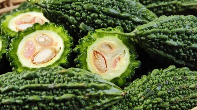Green bitter melon in a basket.