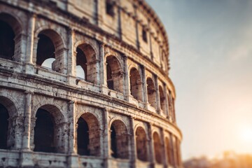 Obraz premium Ancient amphitheater structure features rows of arched openings against a bright sky
