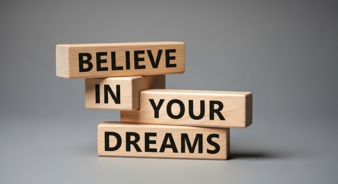 Inspirational wooden blocks with motivational phrase 'believe in your dreams'