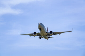 Fototapeta premium Close-up of a commercial airliner approaching for landing
