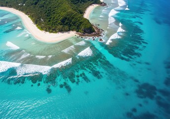 Fototapeta premium Aerial view captures turquoise ocean waves washing onto a secluded tropical beach cove.
